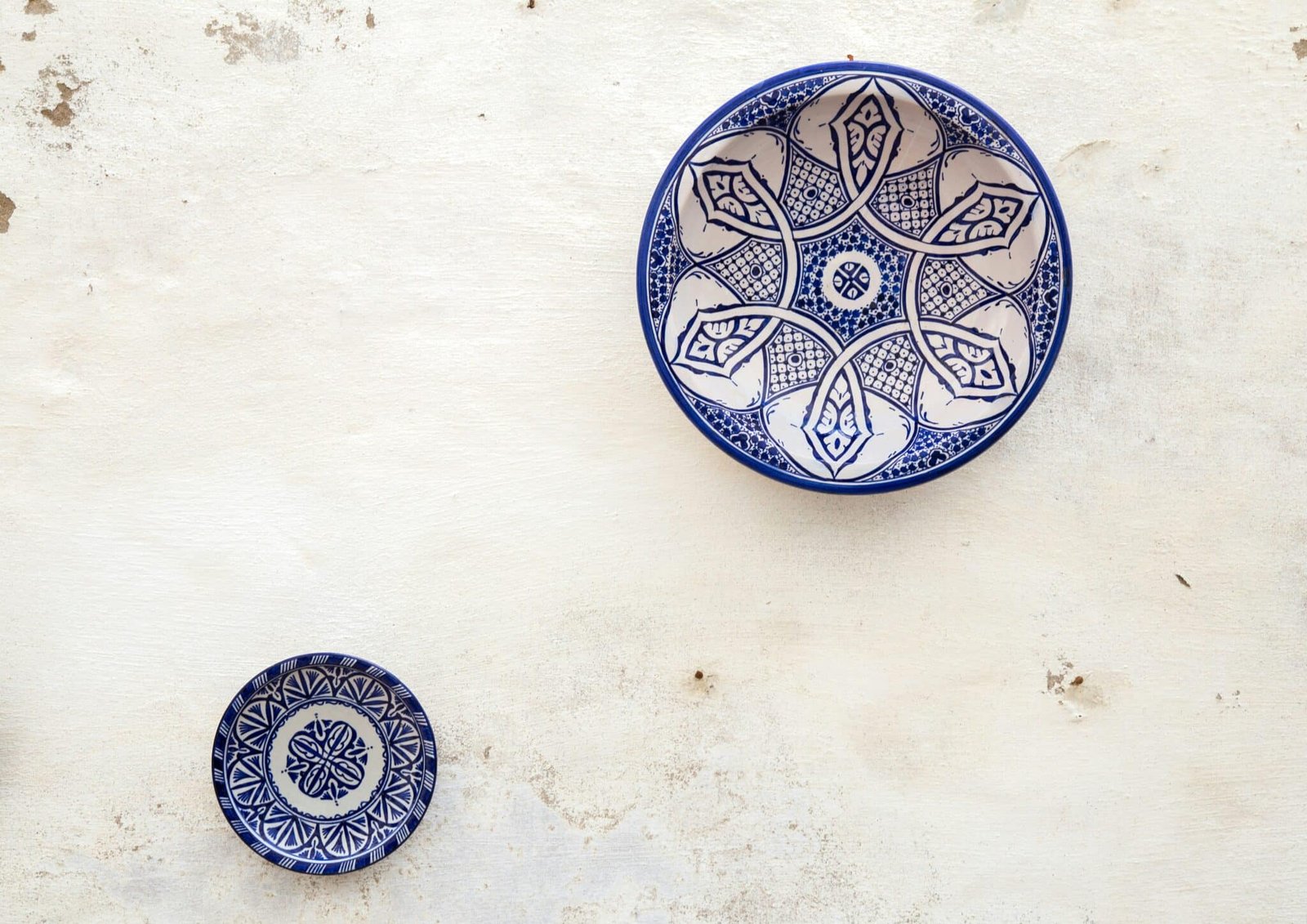 two white-and-blue ceramic dinnerware
